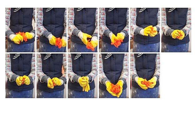 Yellow gloved torso manipulates ribbon (non olympic)